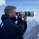 Bastiaan Breemer photographing from a mountain summit